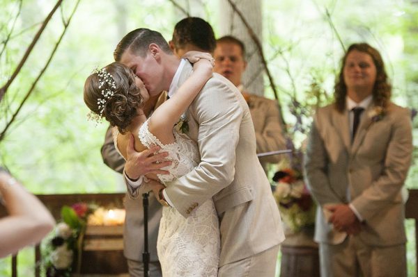 The Kiss  -- Rustic Outdoor Wedding Ceremony in Treetop Pavilion